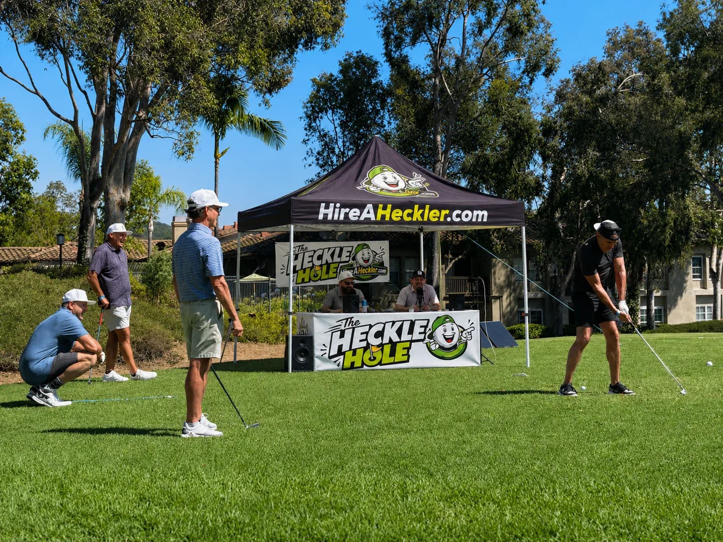 Hire-A-Heckler comedians roasting golfers at a tournament tee box